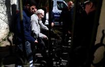 Former Nazi death camp officer Oskar Groening leaves the court after the first day of his trial in Lueneburg, northern Germany, on April 21, 2015