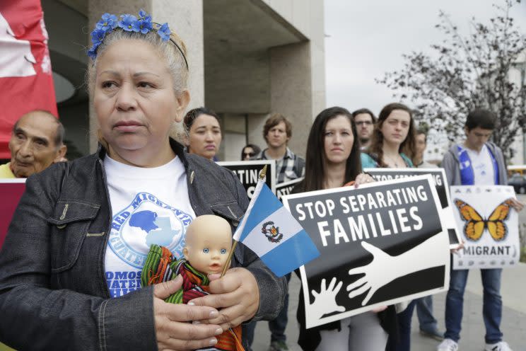 Guatemalan immigrant Amariliz Ortiz rallies with families impacted by immigration raids outside the ICE Metropolitan Detention Center in downtown Los Angeles in May. (Photo: Nick Ut/AP)