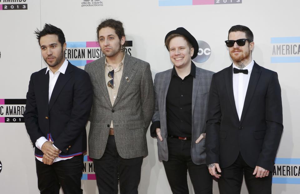 Pete Wentz, Joe Trohman, Patrick Stump and Andy Hurley of Fall Out Boy arrive at the 41st American Music Awards in Los Angeles