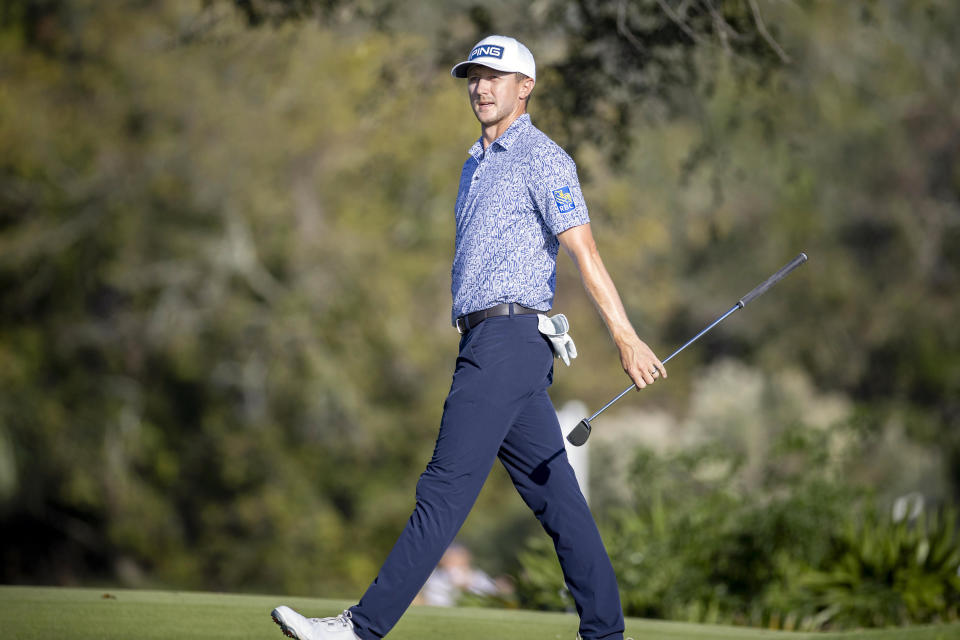 Mackenzie Hughes reacts to a missed birdie putt on the 16th green during the final round of the RSM Classic golf tournament, Sunday, Nov. 19, 2023, in St. Simons Island, Ga. (AP Photo/Stephen B. Morton)