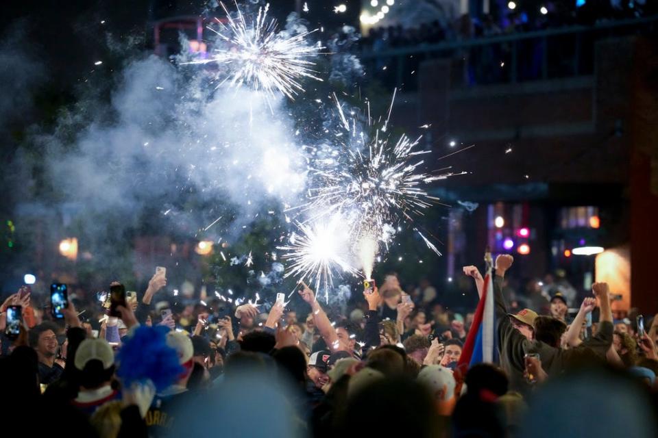 People celebrate after the Denver Nuggets won the NBA Championship with a victory over the Miami Heat on June 12, 2023.