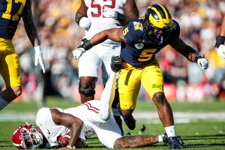 Michigan defensive end Josaiah Stewart celebrates a sack against Alabama quarterback Jalen Milroe during the first half of the Rose Bowl in Pasadena, California, on Monday, Jan. 1, 2024.