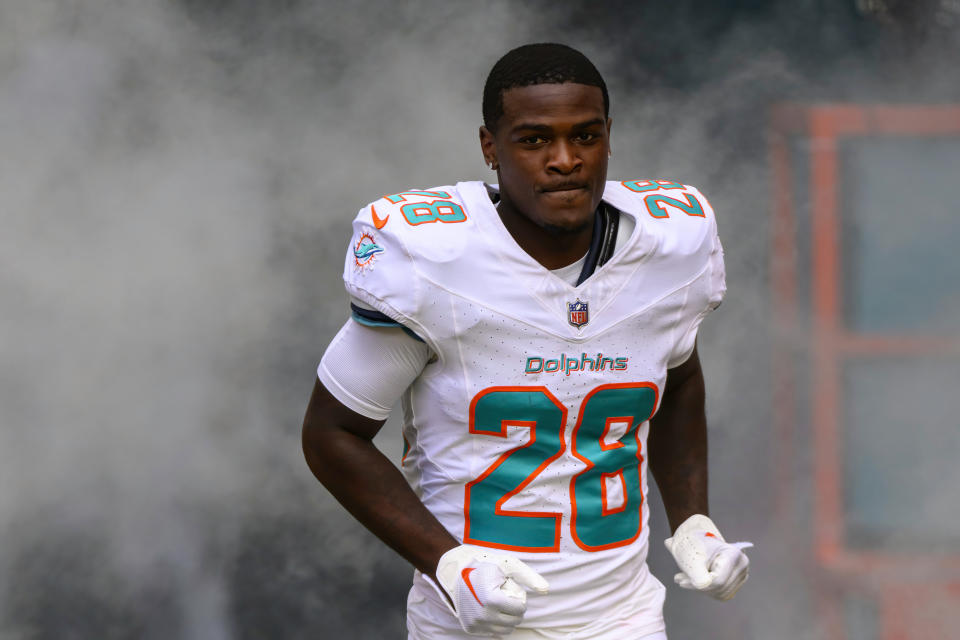 Miami Dolphins running back De'Von Achane (28) runs onto the field during player introductions before an NFL football game against the Las Vegas Raiders, Sunday, Nov. 19, 2023, in Miami Gardens, Fla. (AP Photo/Doug Murray)