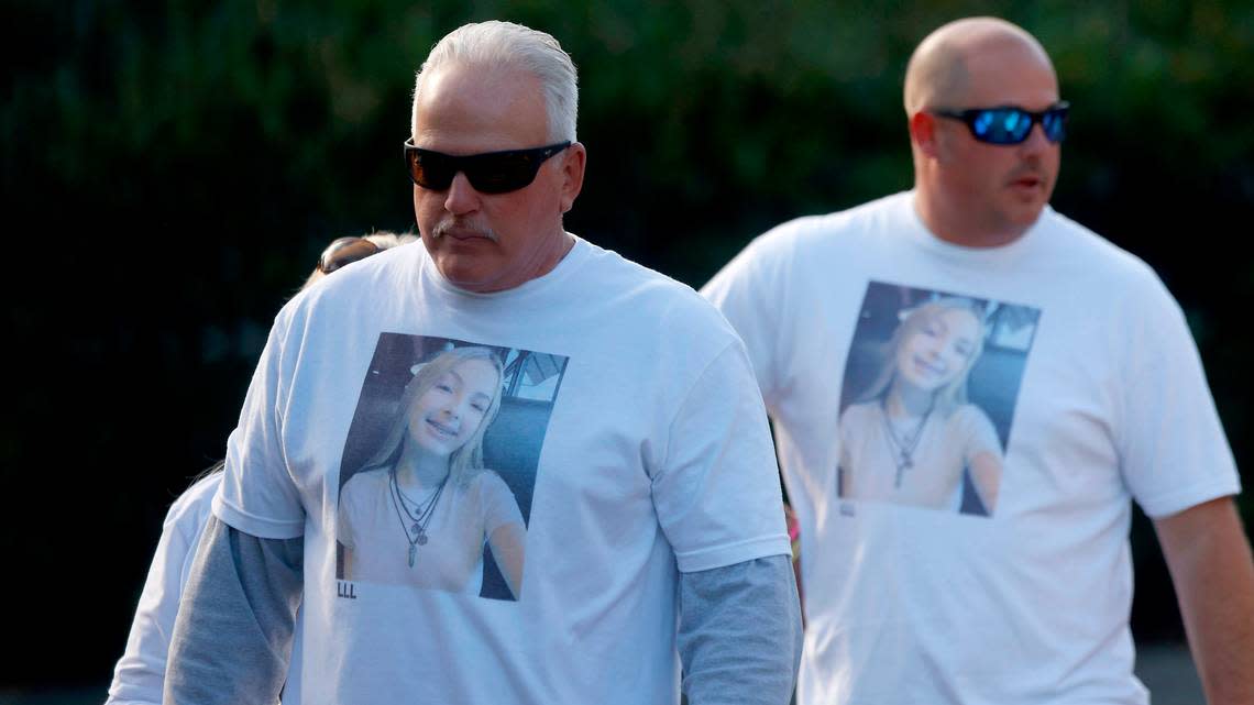 Stan Dean, the grandfather of Lyric Woods, left, and others exit the Orange County Courthouse following a hearing regarding the double homicide of two teenagers in Orange County on Tuesday, Oct. 25, 2022, in Hillsborough, N.C.