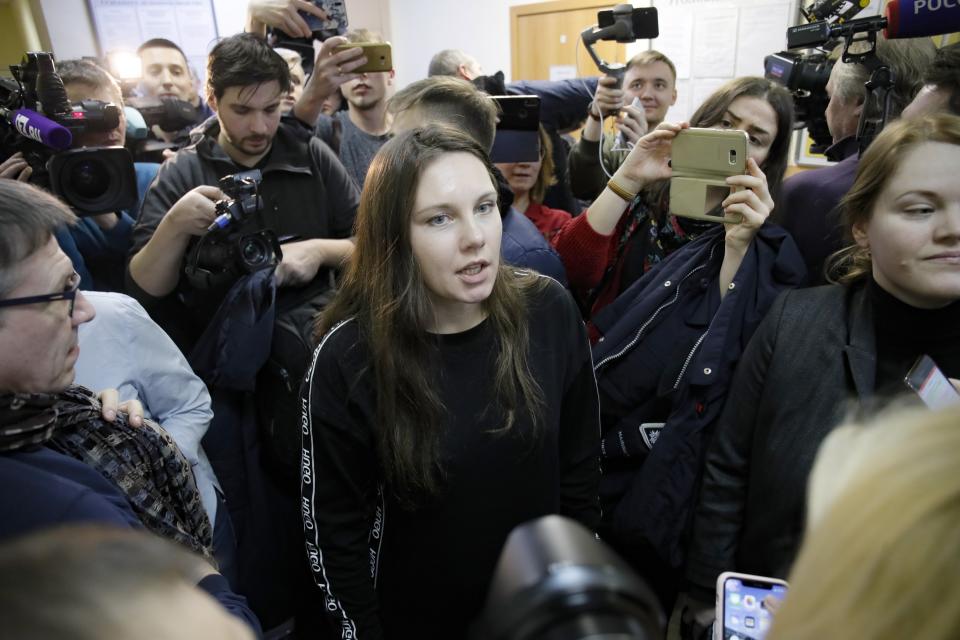 Alla Ilyina, who broke out of the hospital on Feb. 7 after learning that she would have to spend 14 days in isolation instead of the 24 hours doctors promised her, speaks to the Media in a courtroom in St.Petersburg, Russia, Monday, Feb. 17, 2020. A woman who escaped from a hospital in St. Petersburg, where she was being kept in isolation for possible inflection by the new coronavirus, was ordered by court on Monday to return back to the quarantine for at least two days. (AP Photo/Dmitri Lovetsky)