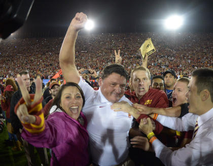 Former USC coach Ed Orgeron celebrates with fans after a win last season. (USA TODAY Sports)
