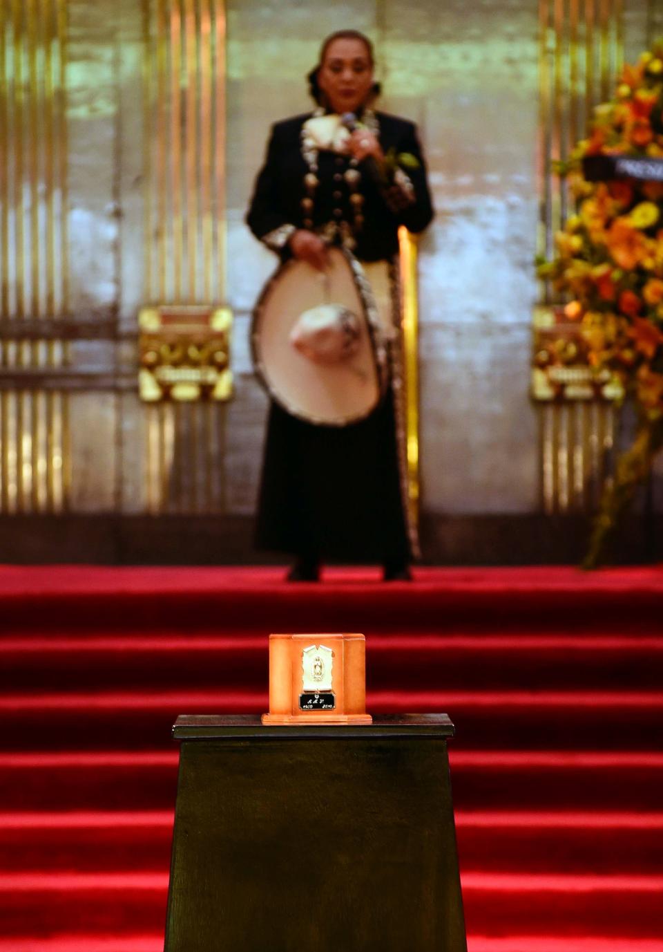 The urn containing the remains of Mexico's late Latin music legend Juan Gabriel is seen at Mexico City's ornate Palace of Fine Arts.