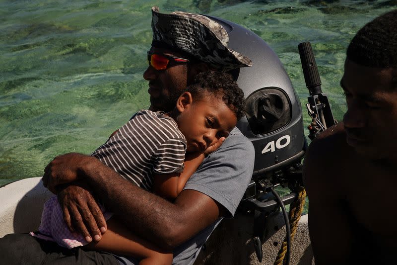 The Wider Image: Rising sea levels are forcing Fiji's villagers to relocate. They want polluters to pay instead