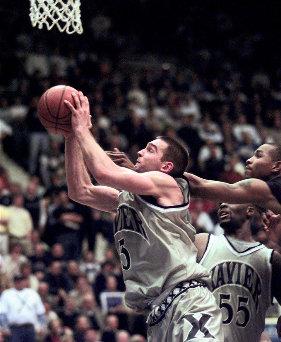Xavier’s Kevin Frey battles for a rebound against the University of Cincinnati during the Crosstown Shootout at the Cincinnati Gardens in 1999.