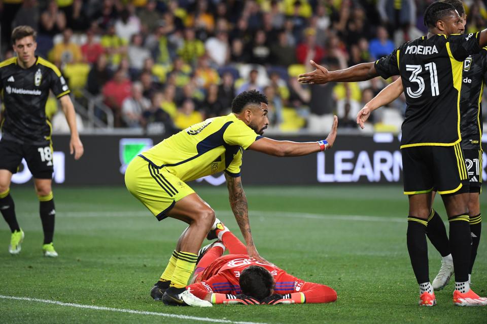 Nashville's Anibal Godoy checks on Crew goalkeeper Patrick Schulte after he was injured on Saturday.