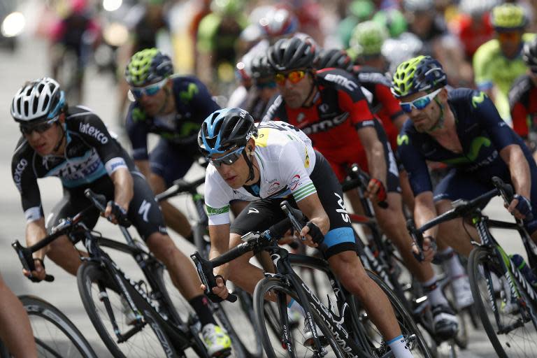 Richie Porte (centre) and Alejandro Valverde (right) race during the last stage of the Tour of Catalonia cycling race in Barcelona on March 29, 2015