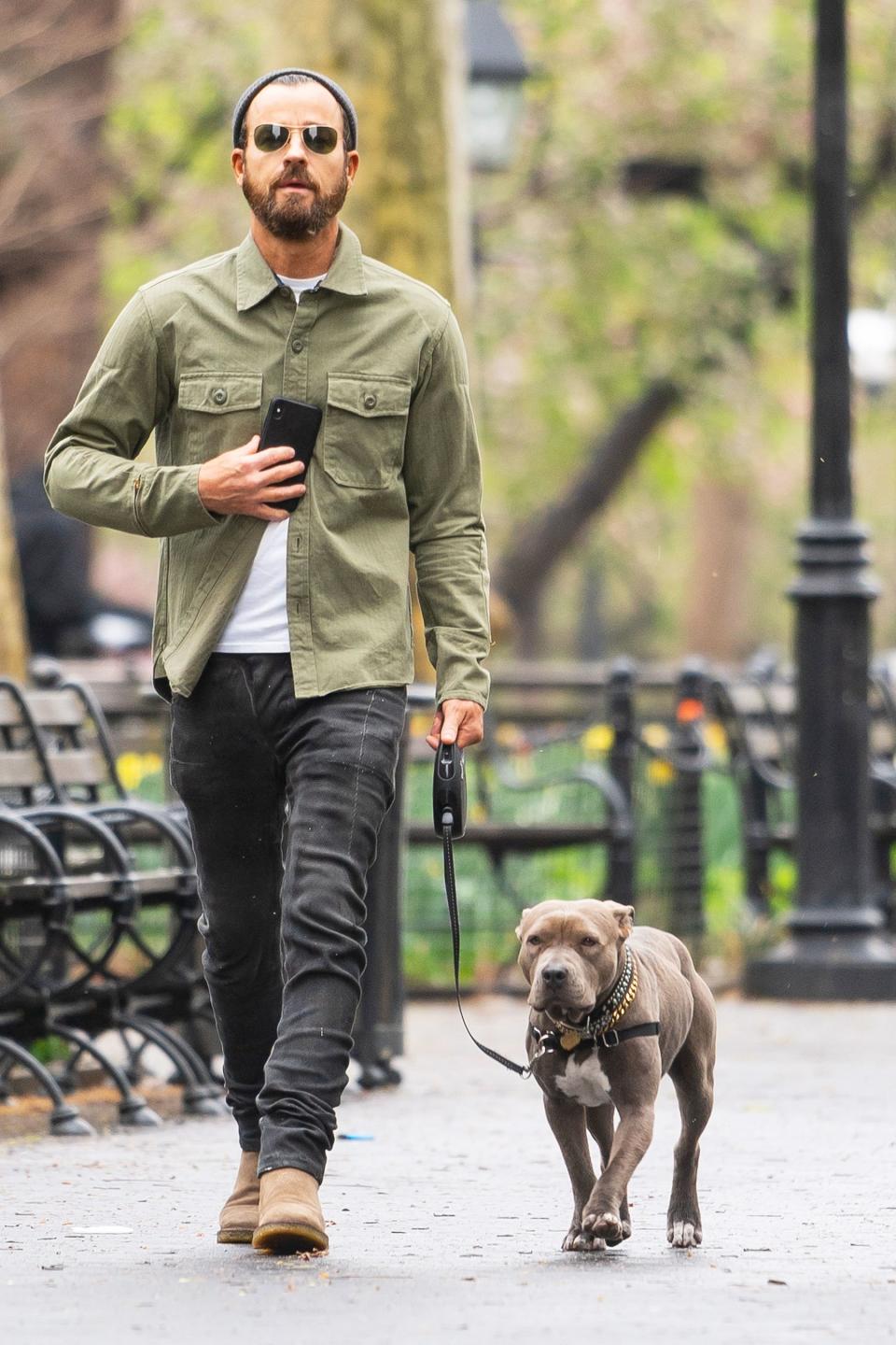 Justin Theroux takes his furry friend for a stroll in N.Y.C.’s Washington Square Park on Saturday.