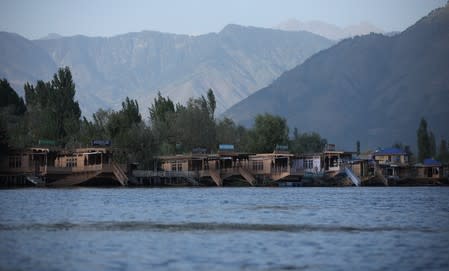 Empty houseboats are seen at Dal lake in Srinagar,