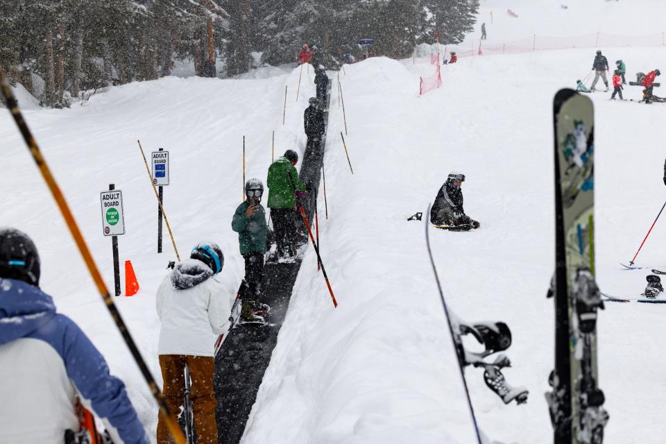 Skiers and snowboarders take the magic carpet at Brighton Resort in Big Cottonwood Canyon on Saturday, Jan. 20, 2024. | Megan Nielsen, Deseret News