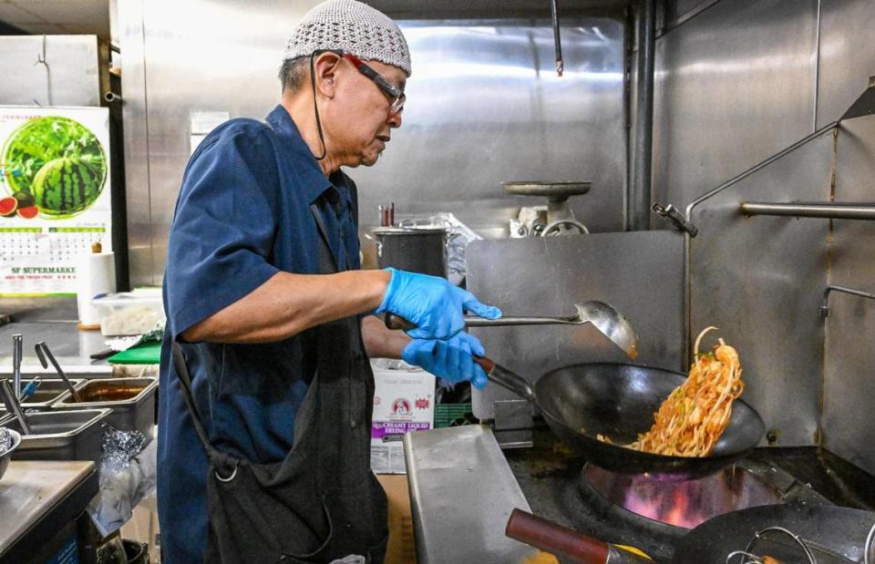 Narong Srinongkhot cooks up his popular pad Thai combo dish with beef, pork chicken and shrimp in the kitchen at U-D Thai restaurant that he opened with his wife and daughter on Kings Canyon Road and Maple Avenue in Fresno late last year.