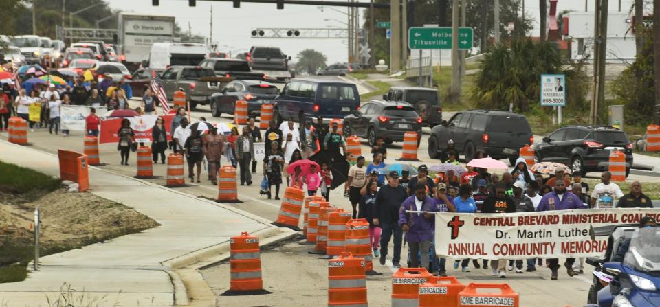 Monday's peace march proceeds past U.S. 1 along King Street in Cocoa.