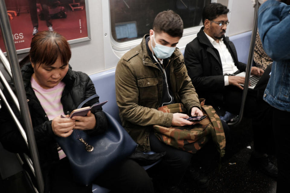 A man wears a medical mask on the subway in New York City, New York on Mar. 11, 2020. | Spencer Platt—Getty Images