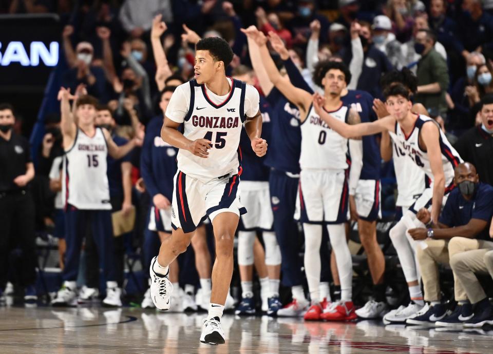 Gonzaga bench celebrates after guard Rasir Bolton (45) three-pointer against the Texas in the second half at McCarthey Athletic Center.