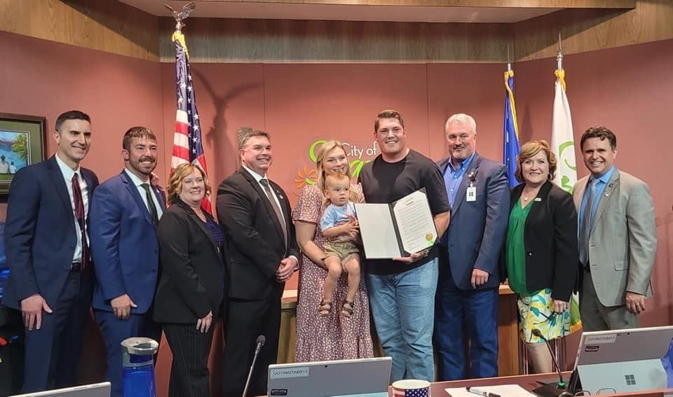 Austin Corbett (center) with his wife and the Sparks City Council celebrate the dedication of Austin Corbett Day on April 25, 2022. (Photo/Courtesy) 