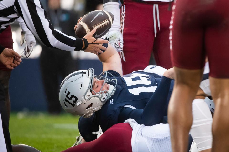 Penn State quarterback Drew Allar (15) scores a touchdown on a 1-yard run during the first half of a NCAA football game against Massachusetts Saturday, Oct. 14, 2023, in State College, Pa.