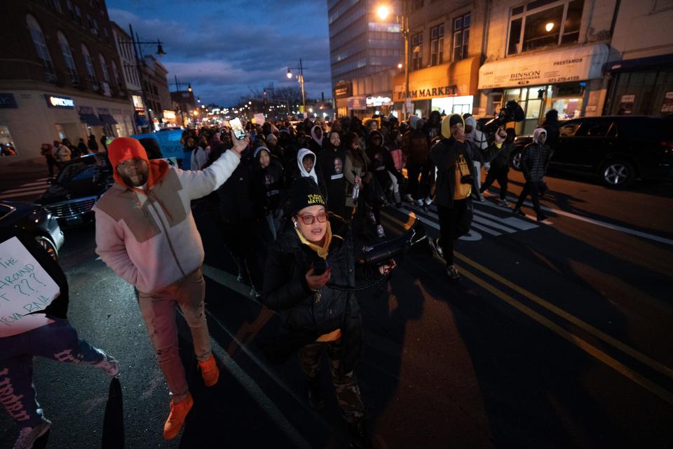 Participants in a rally for Najee Seabrooks march on Market Street towards Paterson City Hall on Tuesday, March 7, 2023. Najee Seabrooks, a member of the violence intervention group the Paterson Healing Collective, was fatally shot by Paterson police  after a standoff while he was barricaded inside his home.