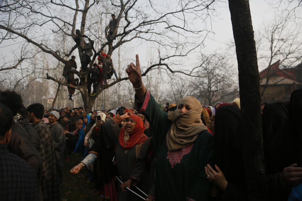 A Kashmiri woman shouts pro freedom slogans during the funeral of killed rebel Khalid Farooq, in Shopian village, south of Srinagar, Indian controlled Kashmir, Sunday, Nov. 25, 2018. Six rebels and an army soldier were killed in a gunbattle in Indian-controlled Kashmir on Sunday, officials said, sparking violent protests by residents seeking an end to Indian rule over the disputed region and leaving a teenage boy dead and 20 people injured. (AP Photo/Mukhtar Khan)
