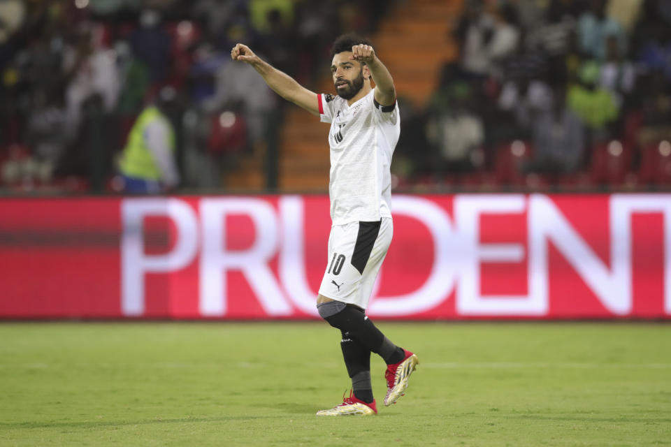 Egypt's Mohamed Salah celebrates after the African Cup of Nations Group D soccer match between Egypt and Guinea-Bissau in Garoua, Cameroon, Saturday, Jan. 15, 2022. (AP Photo/Footografiia)