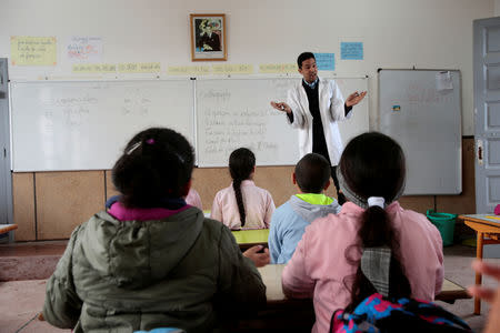 School children listen to their teacher as they study during a class in the Oudaya primary school in Rabat, Morocco January 31, 2019. Picture taken January 31, 2019. REUTERS/Youssef Boudlal