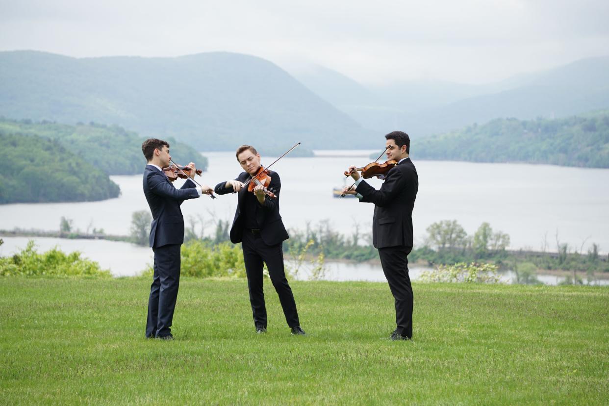From left: Violinist Benjamin Beilman, violist Matthew Lipman and violinist Arnaud Sussmann on the grounds of Boscobel House and Gardens.