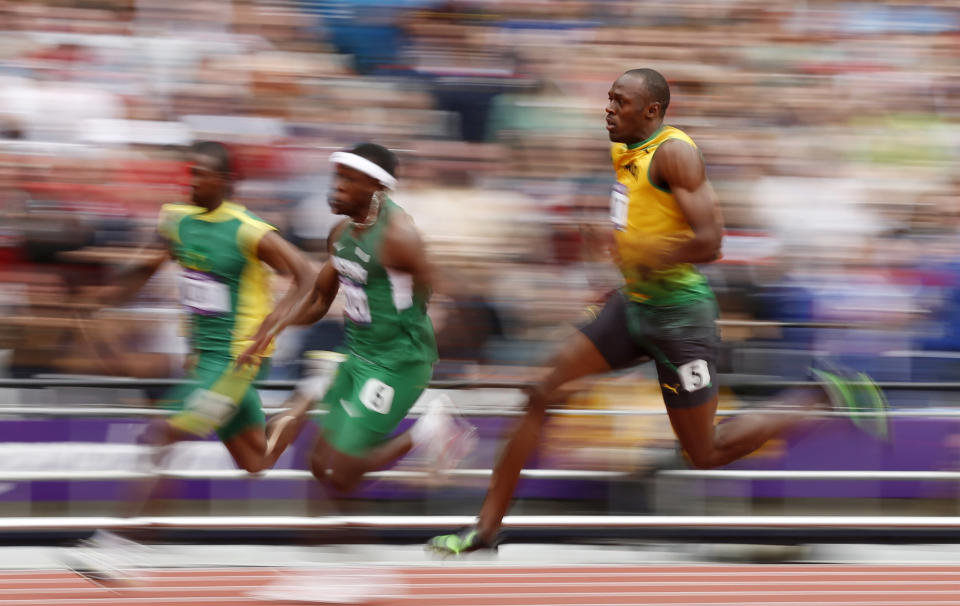 Jamaica's Usain Bolt competes in a men's 200-meter heat during the athletics in the Olympic Stadium at the 2012 Summer Olympics, London, Tuesday, Aug. 7, 2012. (AP Photo/Matt Dunham)