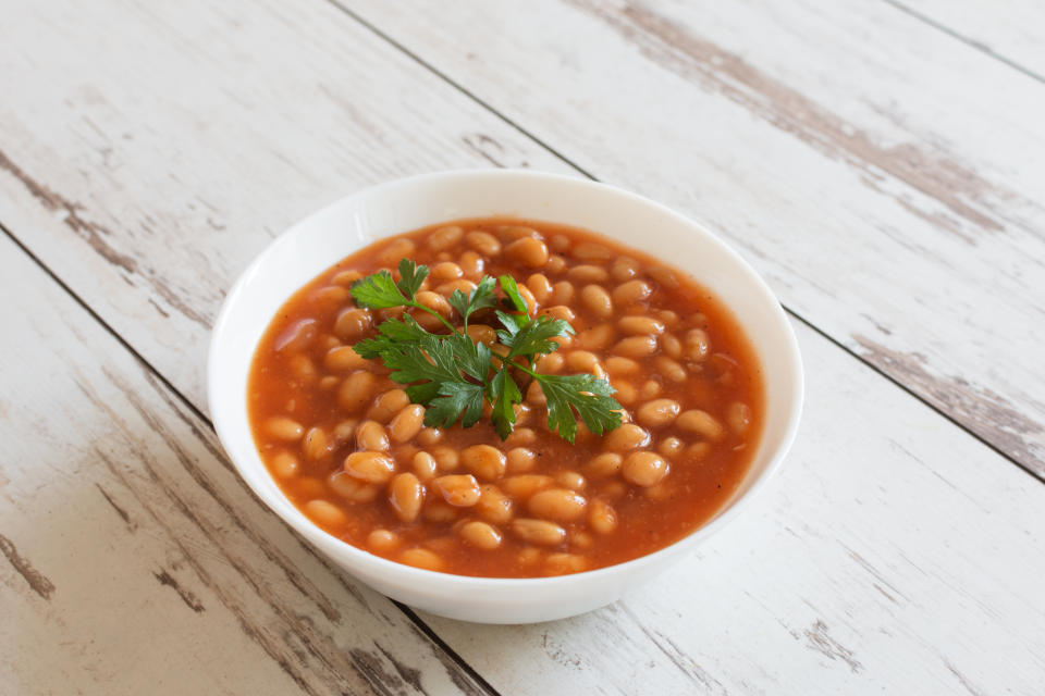 Beans in tomato sauce in a white porcelain bowl