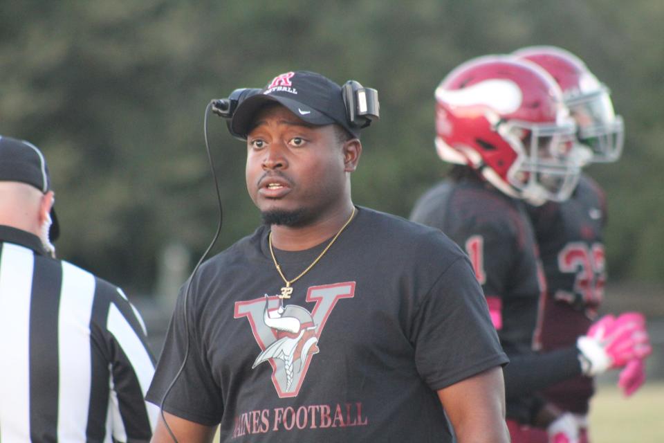 Raines head coach Donovan Maseline looks on during the first half of Raines' game versus Atlantic Coast.