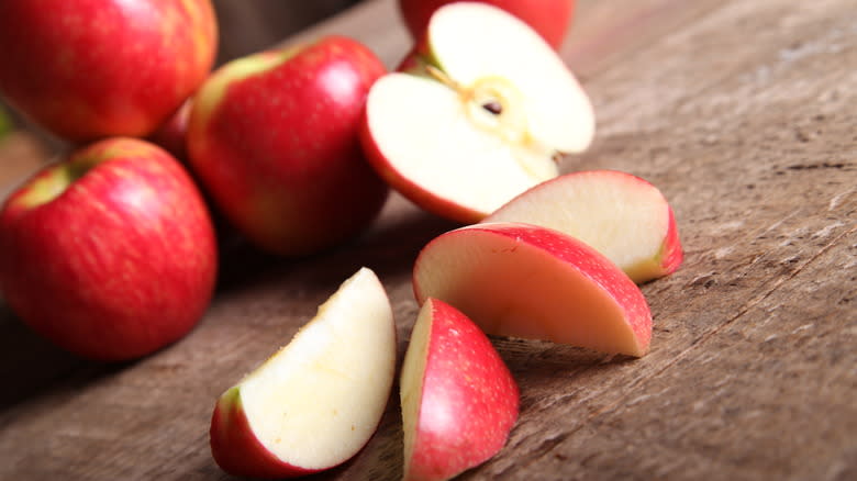 Sliced apples on rustic wood table