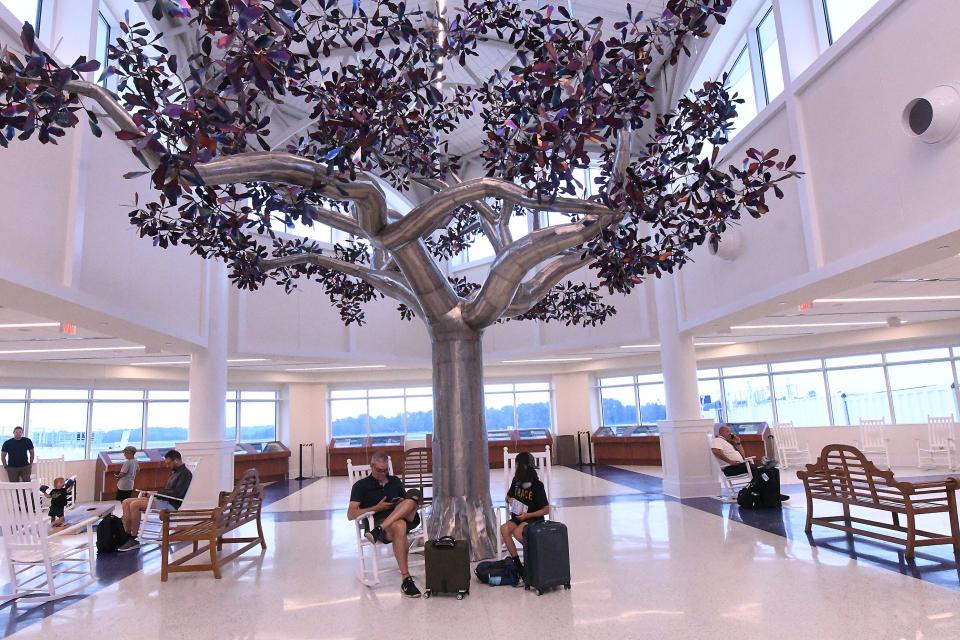 Passengers head to their flights in the newly expanded Wilmington International Airport on Wednesday. The airport is the fastest-growing airport in North Carolina, having added nine new nonstop destinations since 2022.