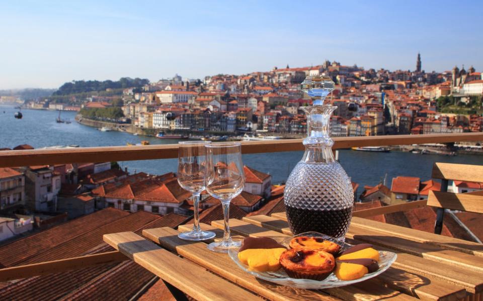 Table with view over the river in Porto - DianaRui/iStockphoto