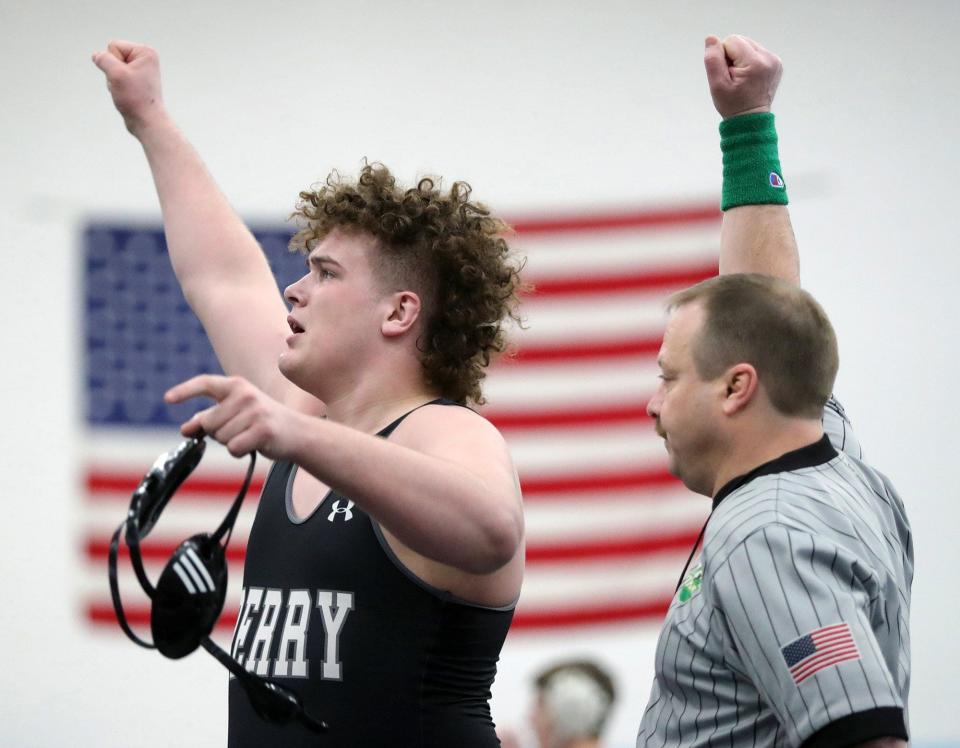 Perry's Aidan Fockler raises his arm after beating Fremont Ross' Ethan Green in a 285 pound semifinal match in the Division I OHSAA State Wrestling Tournament at Hilliard Darby High School, Sunday, March 14, 2021, in Hilliard, Ohio. [Jeff Lange/Beacon Journal]
