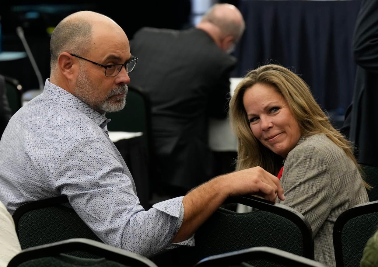 Tamara Lich and Chris Barber wait for the Public Order Emergency Commission to begin last November in Ottawa. The trial for the two leaders of the 2022 convoy protests is slated to get underway Tuesday. (Adrian Wyld/The Canadian Press - image credit)