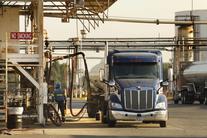 Lamont, California-Sept. 13, 2021-Trucks fill up at the Kern Oil & Refining Company located in Lamont, California, an independent refinery which has been operating continuously since 1934. (Carolyn Cole / Los Angeles Times)