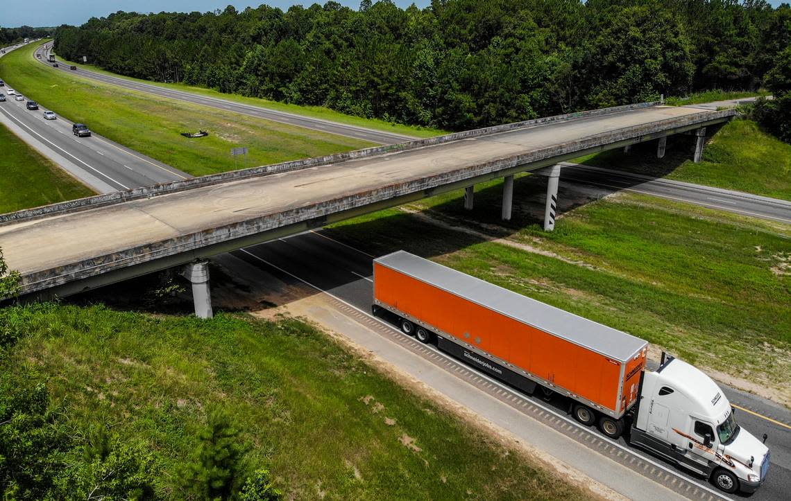 A semi-tractor trailer passes underneath the Purrysburg Road overpass on Monday as it travels northbound on Interstate 95 into Hardeeville town limits. This is the site where the developer of River Port Business Park, City of Hardeeville and Jasper County want a new interchange that will connect to U.S. 17 and U.S. 321 in Jasper County. Drew Martin/dmartin@islandpacket.com