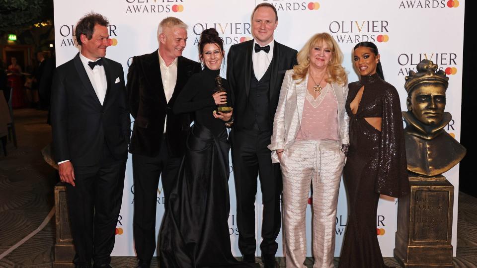 Presenters Dominic West (L) and Freema Agyeman (R) pose in the winners room with winners of the Best New Entertainment or Comedy play for "Stranger Things: The First Shadow", at The Olivier Awards 2024 