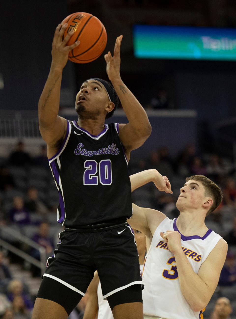 Evansville’s Kenny Strawbridge Jr. (20) goes up for a shot as the University of Evansville Purple Aces play the University of Northern Iowa Panthers at Ford Center in Evansville, Ind., Wednesday, Feb. 8, 2023. The Purple Aces won, 71-59. 