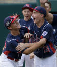 Endwell, N.Y.'s Ryan Harlost (19) begins to celebrate with teammate Jack Hopko, left, after getting the final out of the Little League World Series Championship baseball game against South Korea in South Williamsport, Pa., Sunday, Aug. 28, 2016. (AP Photo/Gene J. Puskar)