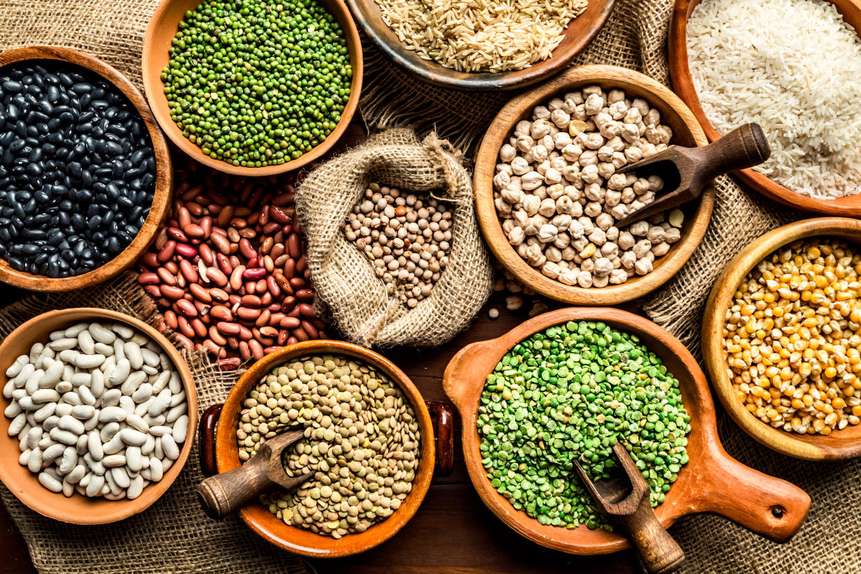 Top view of leguminous seeds on rustic wood table