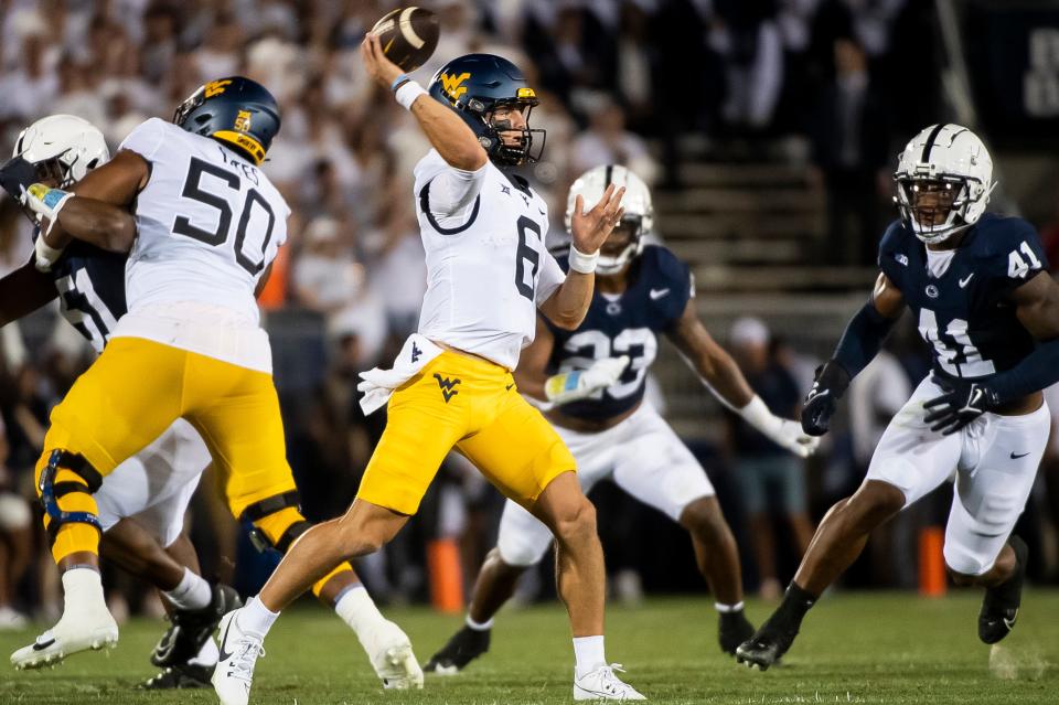 West Virginia quarterback Garrett Greene throws a pass against Penn State on Sept. 2 in State College, Pa.