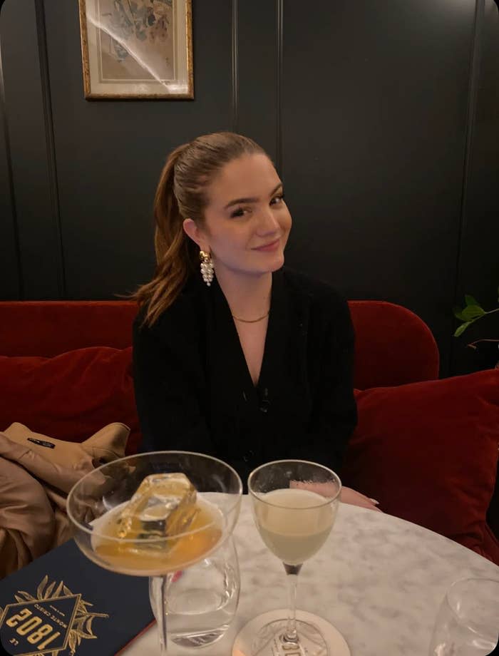 Jackie sitting at a restaurant table and smiling