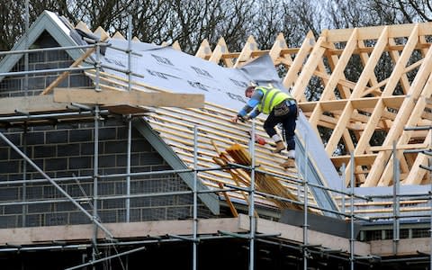 roof workers building new houses in Derbyshire - Credit: Rui Vieira/PA