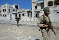 Rebel fighters, part of the Turkey-backed Euphrates Shield alliance, advance on February 20, 2017, towards the city of Al-Bab