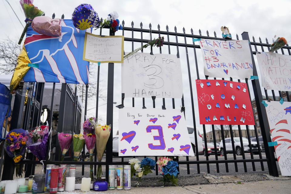 Signs sit along a fence outside UC Medical Center where Buffalo Bills safety Damar Hamiln remains hospitalized, Thursday, Jan. 5, 2023, in Cincinnati. Damar Hamlin has shown what physicians treating him are calling “remarkable improvement over the past 24 hours,” the team announced in a statement on Thursday, three days after the player went into cardiac arrest and had to be resuscitated on the field. (AP Photo/Joshua A. Bickel)