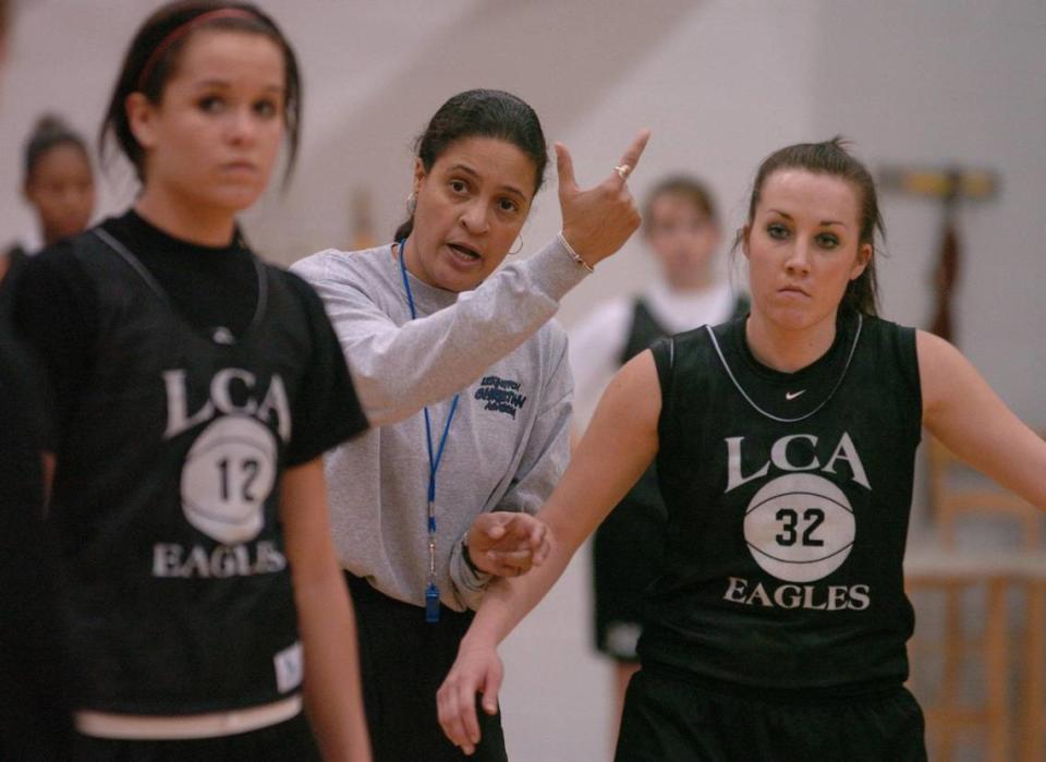 Donna Murphy gave instructions to Cara Johnson, left, and Kayla Yates during her coaching tenure at Lexington Christian Academy.