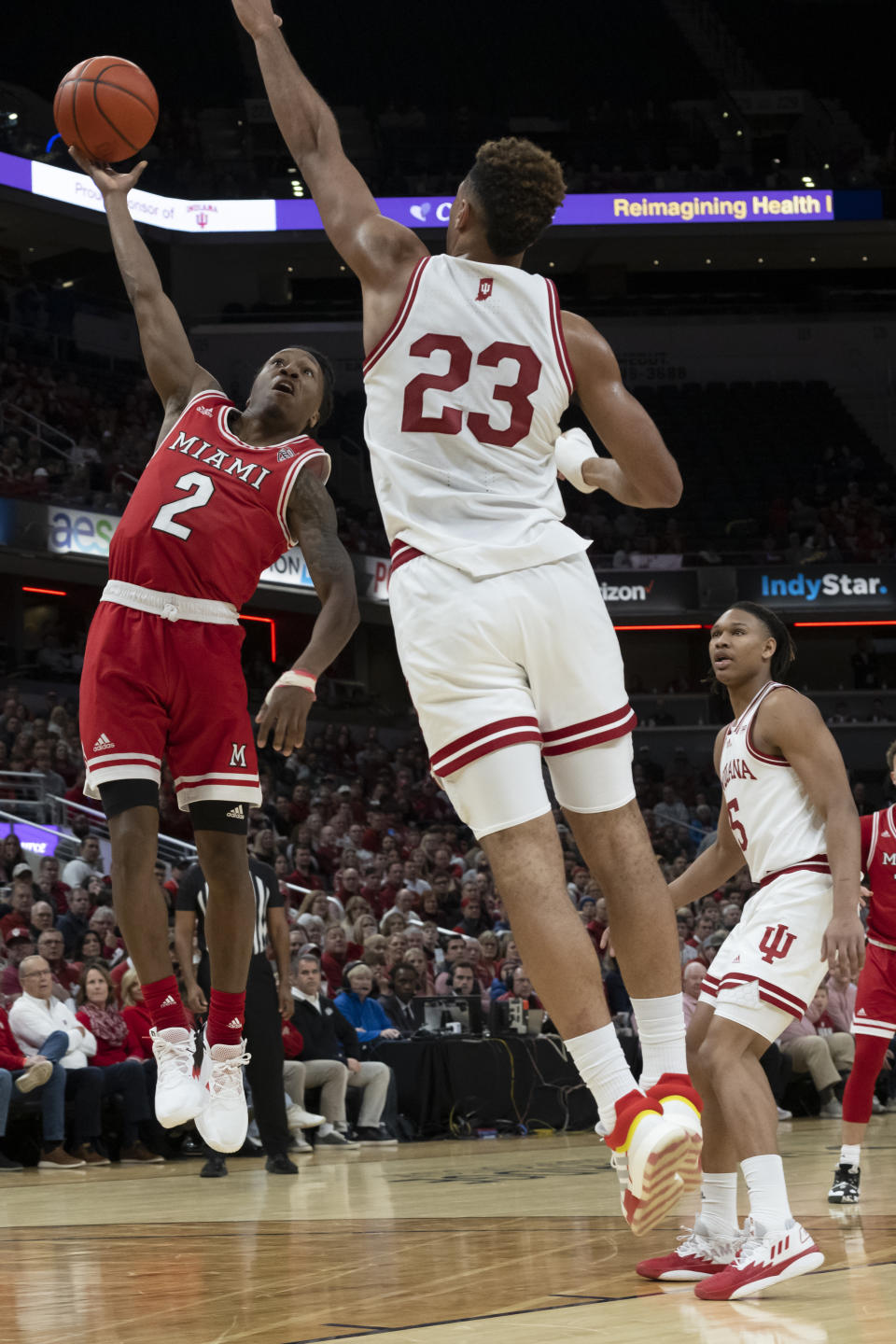 Miami (Ohio) guard Mekhi Lairy (2) shoots the ball over Indiana forward Trayce Jackson-Davis (23) during the first half of an NCAA college basketball game, Sunday, Nov. 20, 2022, in Indianapolis. (AP Photo/Marc Lebryk)